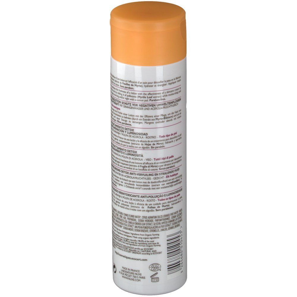 Witte fles met oranje dop. Achterkant met meertalige tekst. Detox Lotion. Voor alle huidtypes.