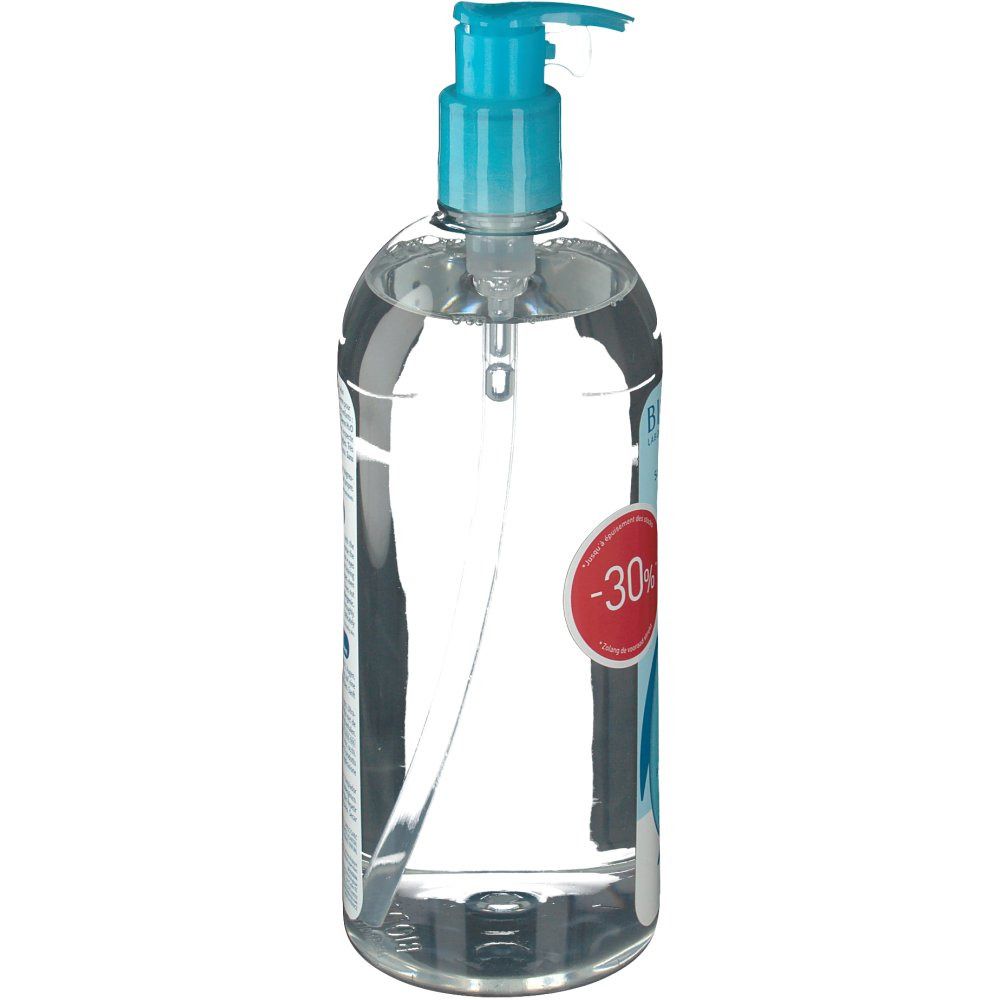 Transparante fles met blauwe pompdeksel. Etiket met tekst en -30% kortingsaanduiding. Vloeistof zichtbaar.