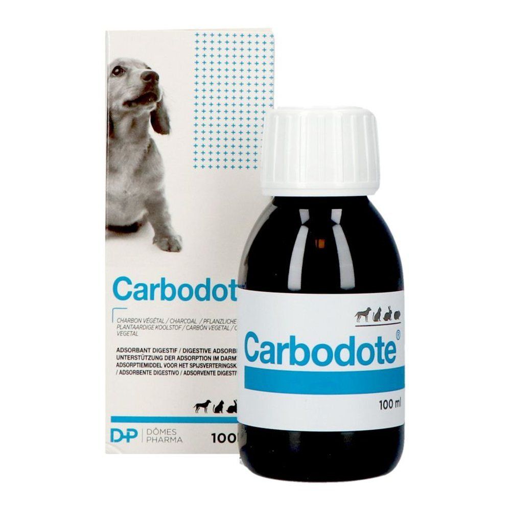Productverpakking en fles. Opschrift Carb, blauwe lijn, 100 ml. Hond op de verpakking.