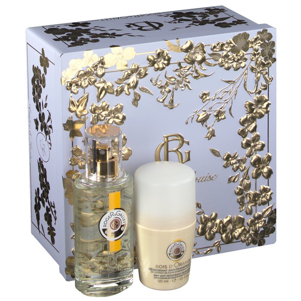 Coffret cadeau avec flacon, déodorant et boîte. Le flacon et le déodorant sont devant une boîte bleu clair avec des motifs floraux dorés.