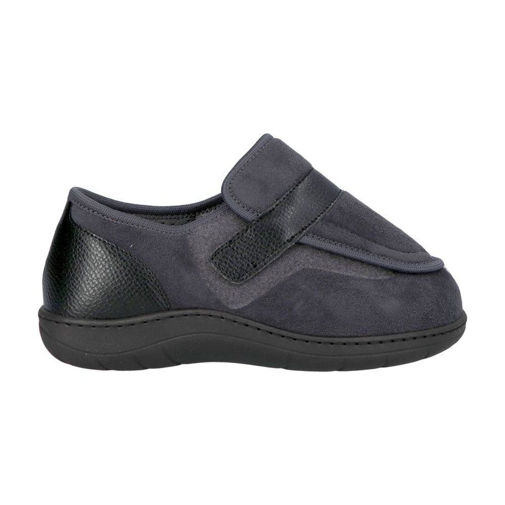 Chaussure de confort grise. Semelle et talon noirs. Fermeture velcro. Vue latérale.