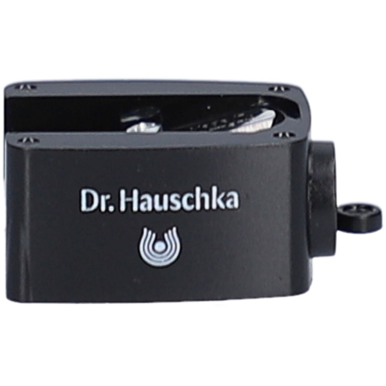 Taille-crayon noir avec le texte Dr. Hauschka et logo. Ouverture latérale.