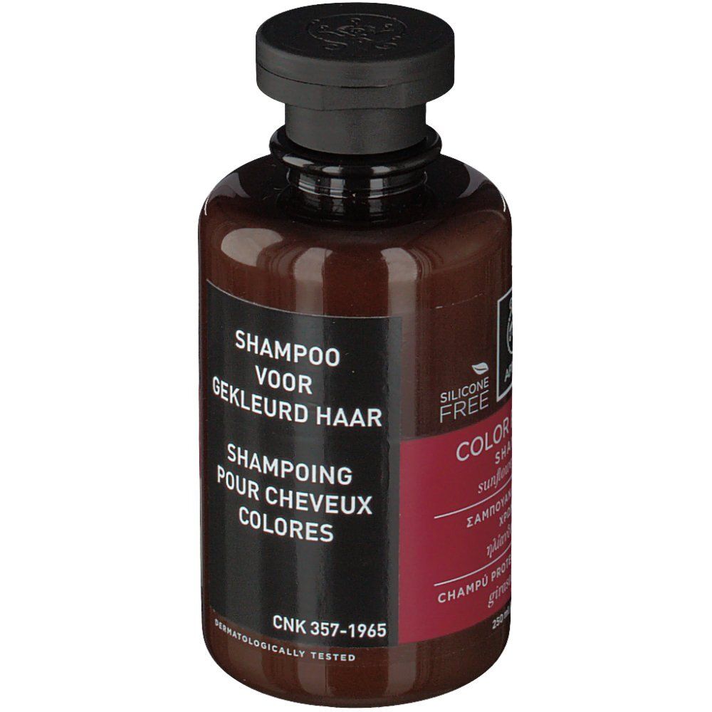 Achterkant van de bruine fles. Etiket met tekst in het Nederlands en Frans.