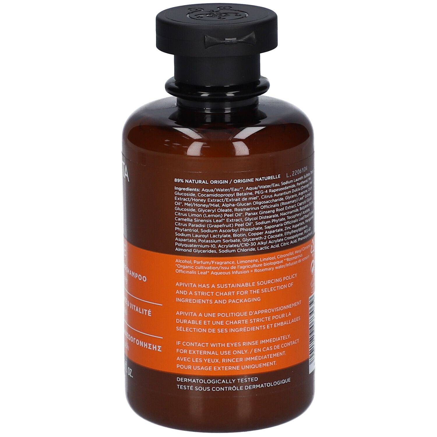 Bruine shampoofles met zwarte klapdop. Etiket met ingrediënten en productinformatie.