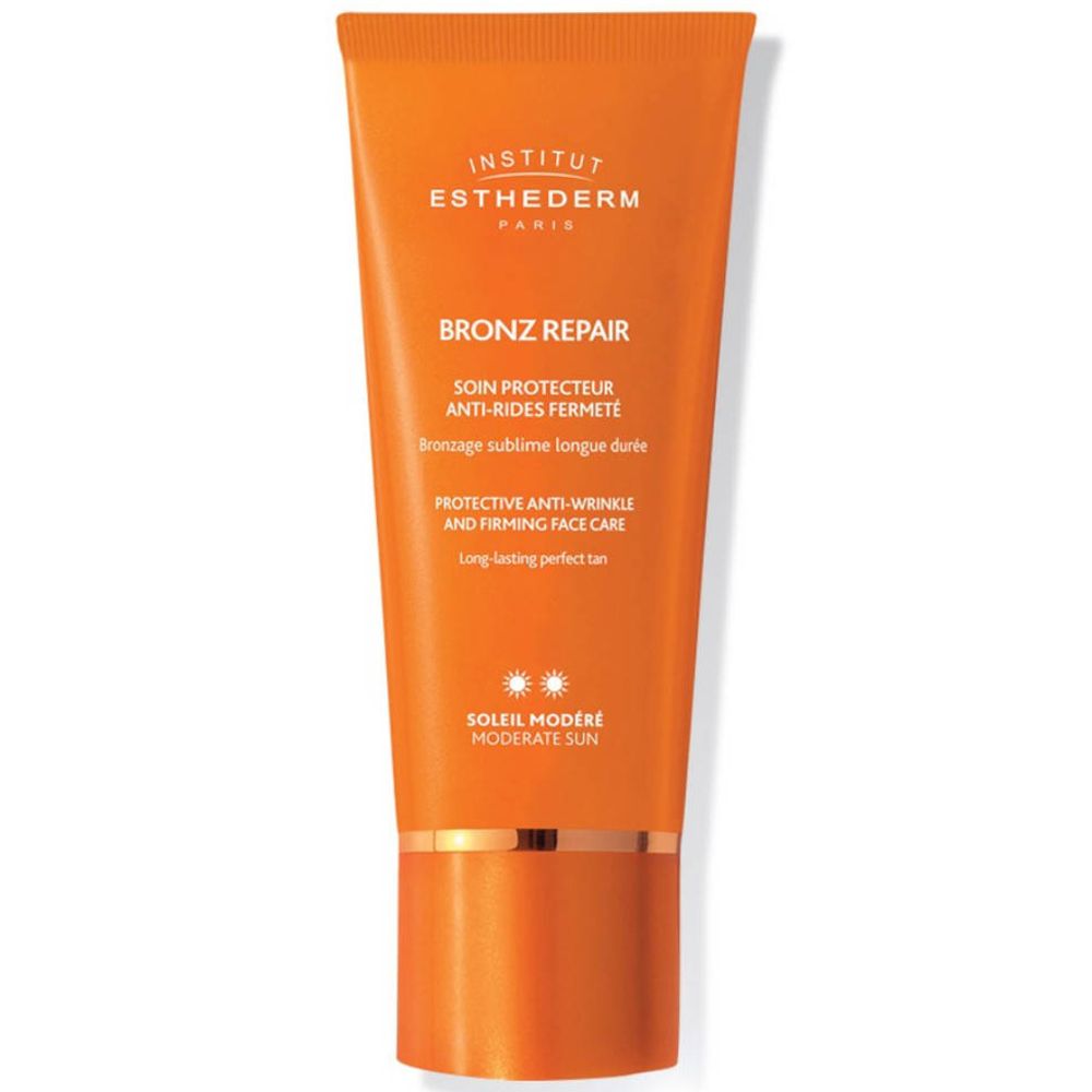 Oranje tube met INSTITUT ESTHEDERM, BRONZ REPAIR en tekst. Anti-rimpel zonnebrandcrème.