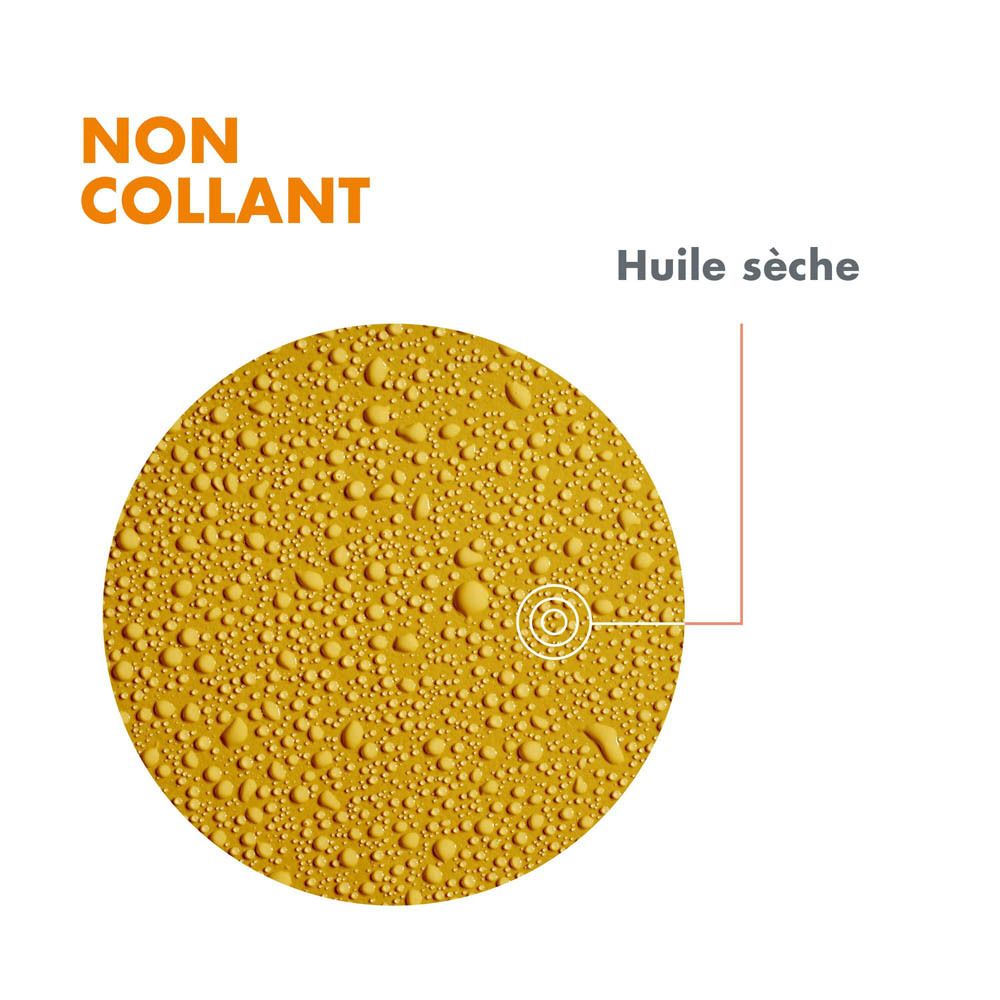 Produit Avene. Gros plan de gouttes de liquide jaune. Huile sèche.