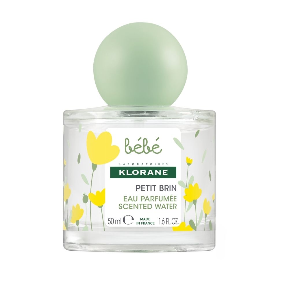 Klorane Bébé Petit Brin Eau Parfumé, 50ml flesje met blauwe dop en bloemenpatroon.