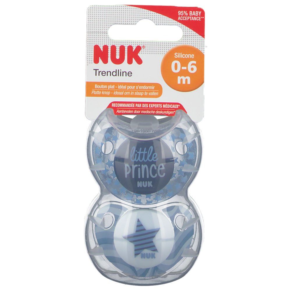 Deux sucettes bleues NUK Trendline dans un emballage. Avec l'impression 'little Prince' et une étoile. Pour 0-6 mois.