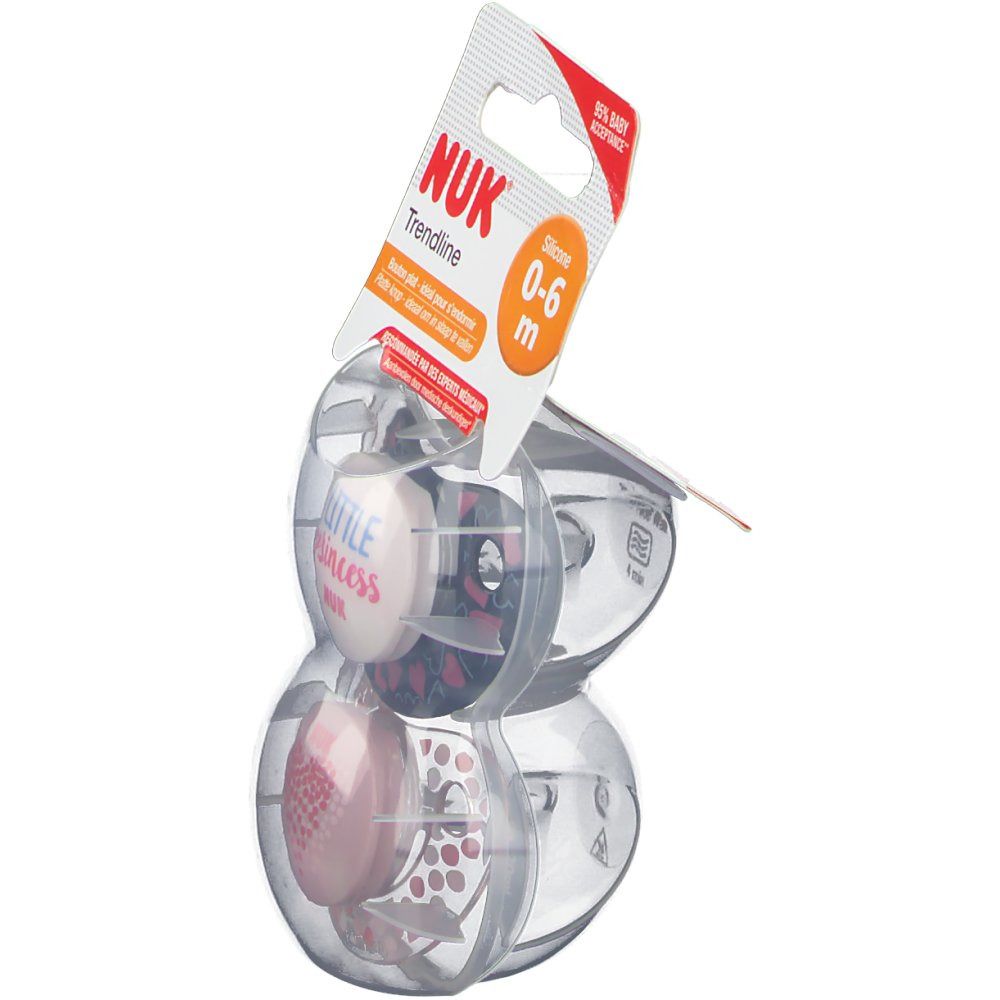 Deux sucettes dans un emballage transparent. Inscriptions : NUK, Trendline, 0-6 m, Little Princess. Emballage avec crochet.