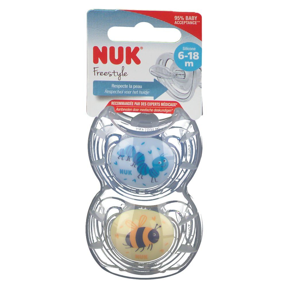 Twee NUK Freestyle fopspenen, maat 2 (6-18 maanden), in verpakking. Blauwe en gele speen met dierenontwerp.