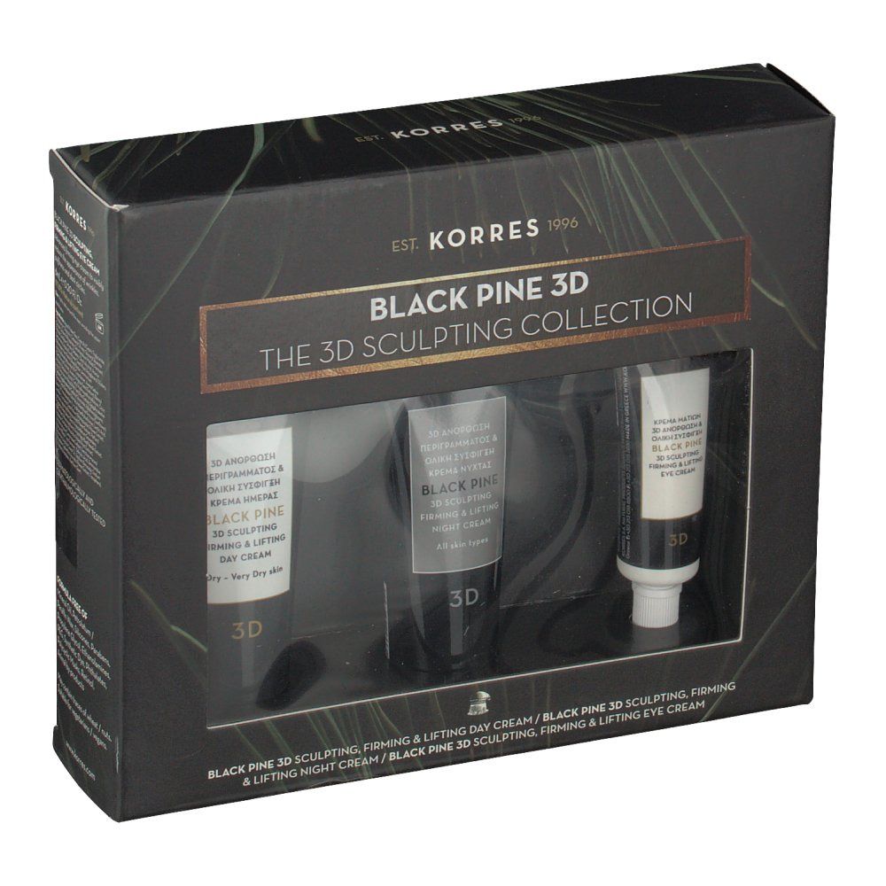 Zwarte geschenkverpakking met drie tubes cosmetica. Merknaam en tekst zijn zichtbaar.