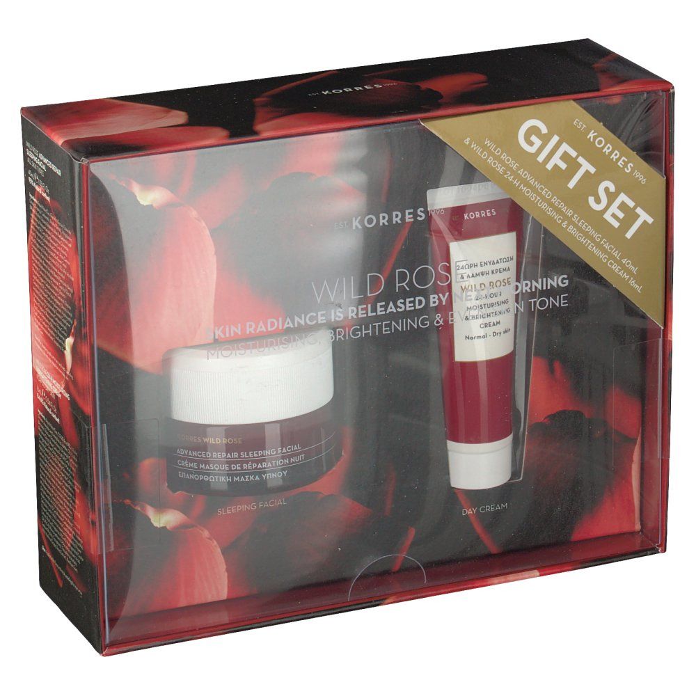 Cadeauset met twee cosmetische producten. Een pot en een tube in een rode verpakking met transparante deksel. Tekst: Wild Rose, Gift Set.