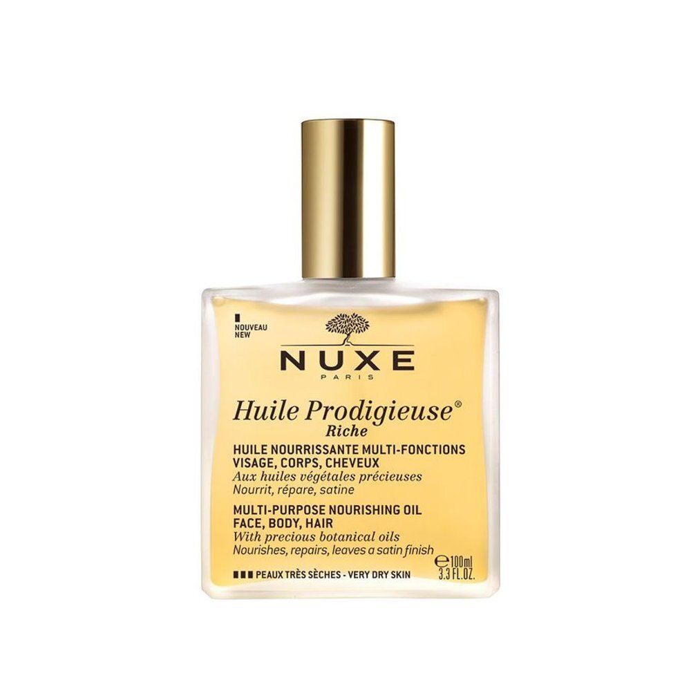 NUXE Huile Prodigieuse Riche fles, schuin van voren gezien. Gele olie met gouden dop.