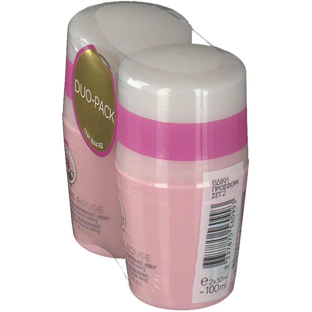Twee roze deodorant roll-ons verpakt in folie. Witte dop, roze band. Opschrift: Duo-Pack. Tekst op achterkant.