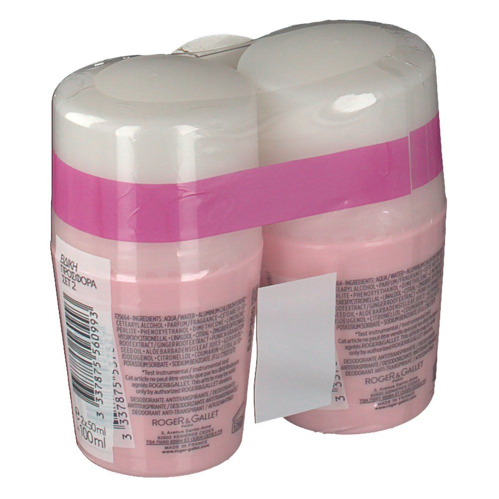 Twee roze deodorant roll-ons verpakt in folie. Witte dop, roze band. Tekst op achterkant en etiket.