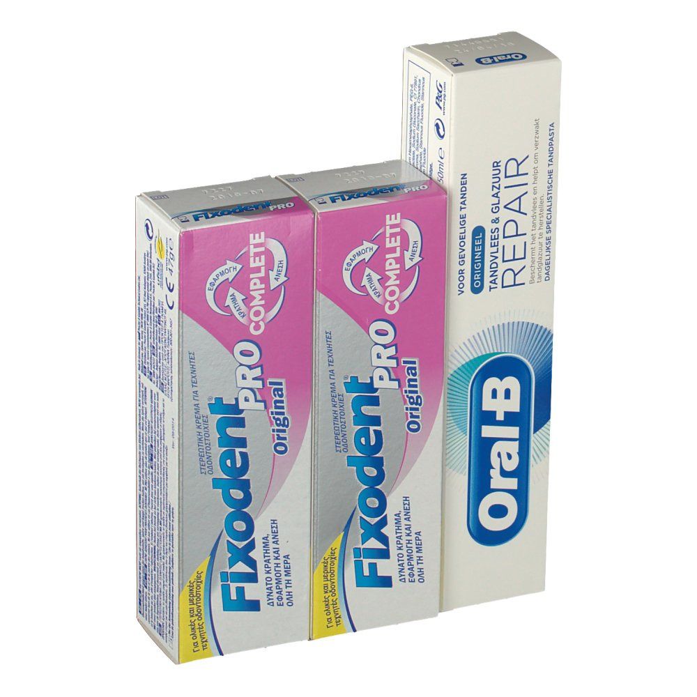 Verpakkingen van tandpasta en kleefcrème. Oral-B tandpasta en twee Fixodent Pro Complete verpakkingen. Verschillende talen op de verpakkingen.