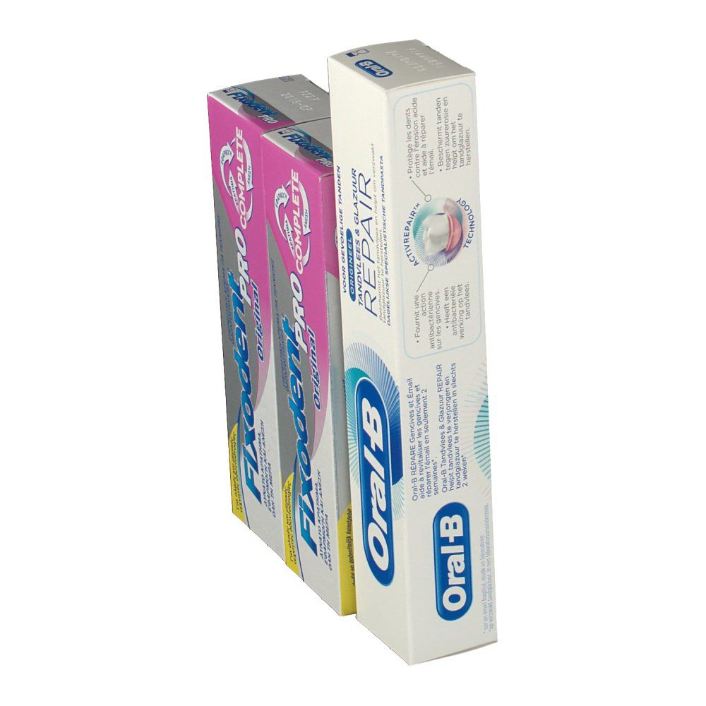 Verpakkingen van tandpasta en kleefcrème. Oral-B tandpasta en twee Fixodent Pro Complete verpakkingen. Schuine weergave.