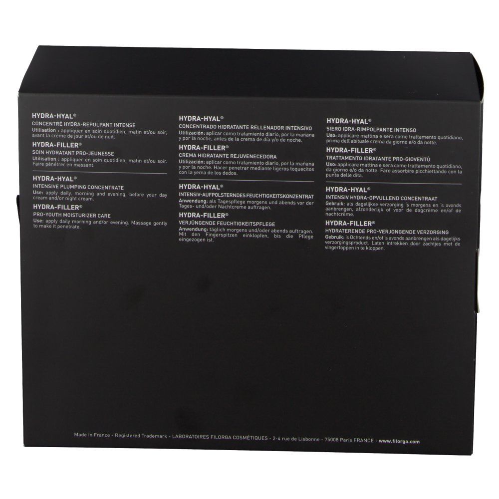 Achterkant van de zwarte geschenkverpakking. Meertalige tekst. Merknaam Filorga. Productnamen: Hydra-Hyal, Hydra-Filler, Pro-Youth Moisturizer Care.