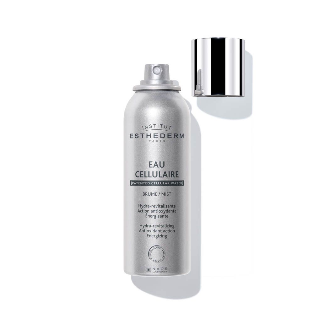 Flacon spray argenté avec bouchon argenté. Inscription : EAU CELLULAIRE BRUME-MIST.