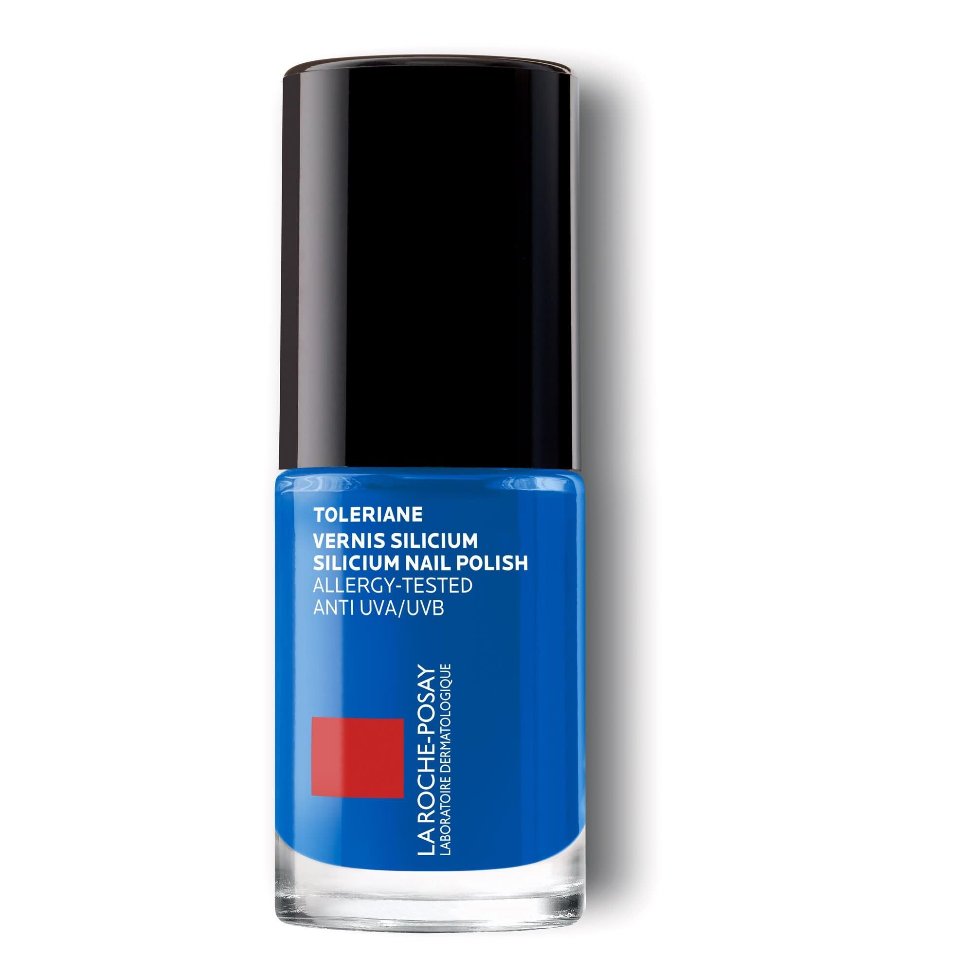 Blauwe nagellakfles met zwarte dop. Merk La Roche-Posay. Tekst: Toleriane, Silicium Nail Polish.