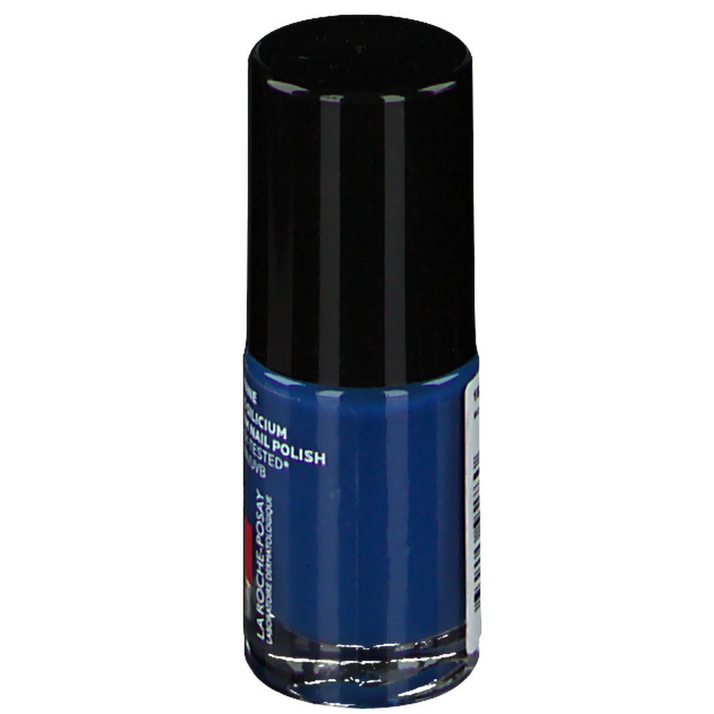 Donkerblauwe nagellakfles met zwarte dop. Merk La Roche-Posay. Tekst: Toleriane, Silicium Nail Polish.