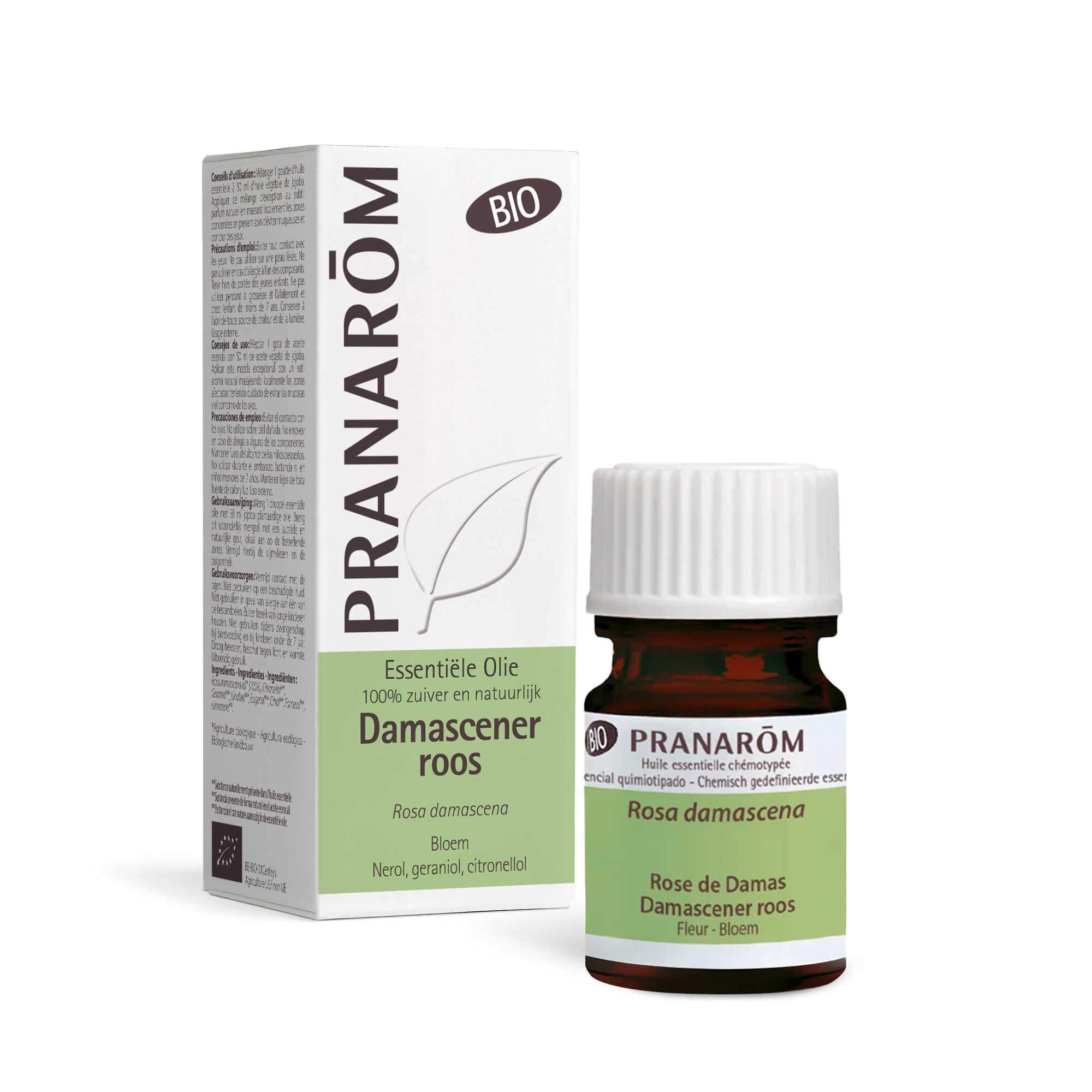 Productfles en verpakking. Bruine glazen fles met witte dop. Verpakking met productnaam en merk: Pranarôm. Bio-certificering.