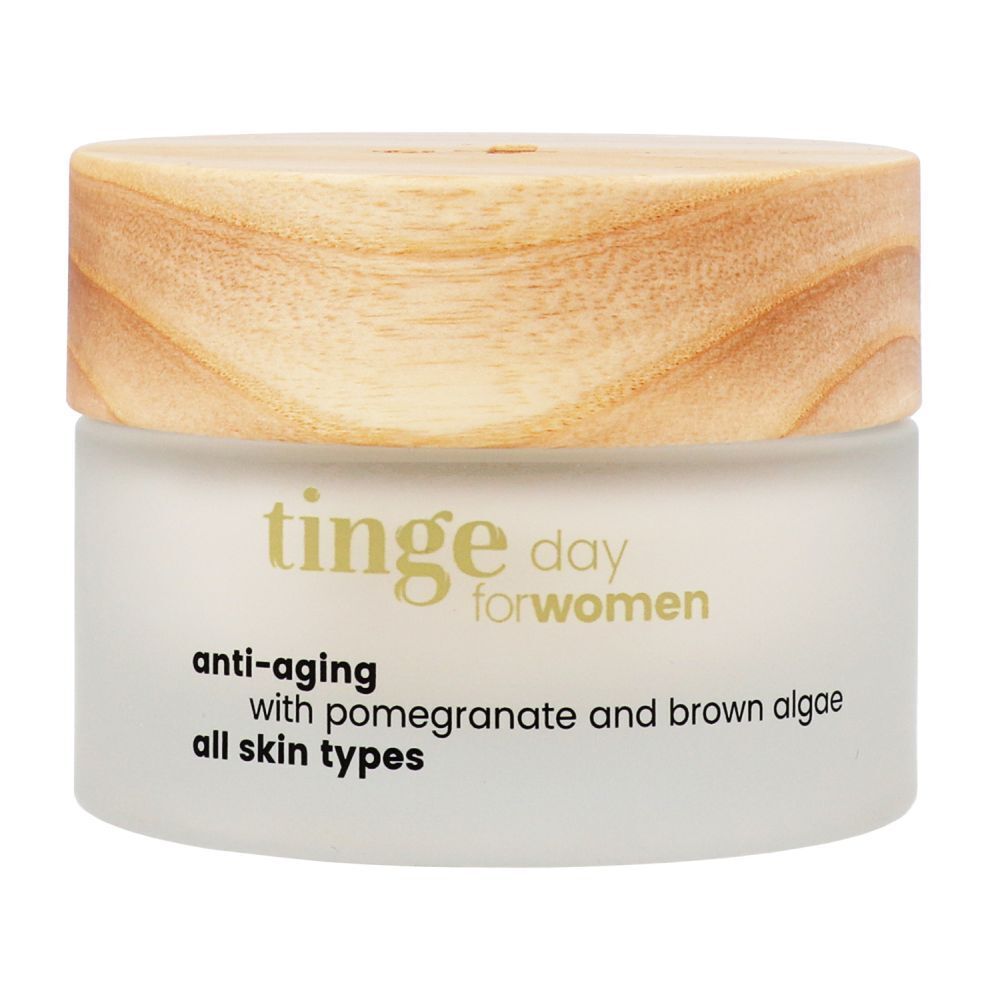 Crème de jour Tinge pour femmes. Pot en verre avec couvercle en bois. Inscription : Anti-âge, grenade et algues brunes, tous types de peau.