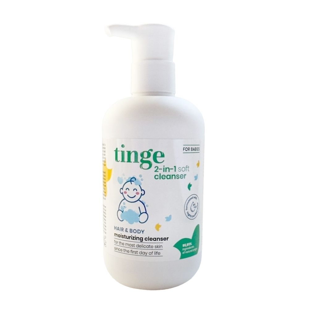 Flacon blanc avec pompe. Inscription : Tinge for babies, gel nettoyant 2 en 1 pour cheveux et corps. Contient une pompe.