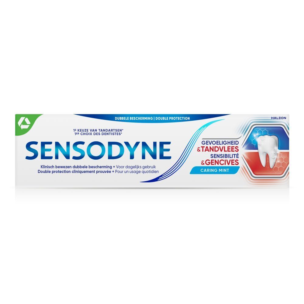 Tandpastatube. Wit, blauw en rood. Tekst: SENSODYNE, Gevoeligheid & Tandvlees, Sensibilité & Gencives, Caring Mint.