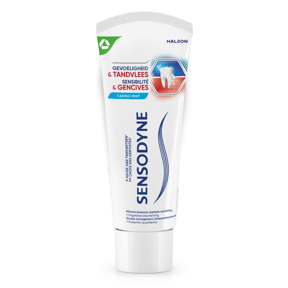 Tandpastatube. Wit, blauw en rood. Tekst: SENSODYNE, Gevoeligheid & Tandvlees, Sensibilité & Gencives, Caring Mint.