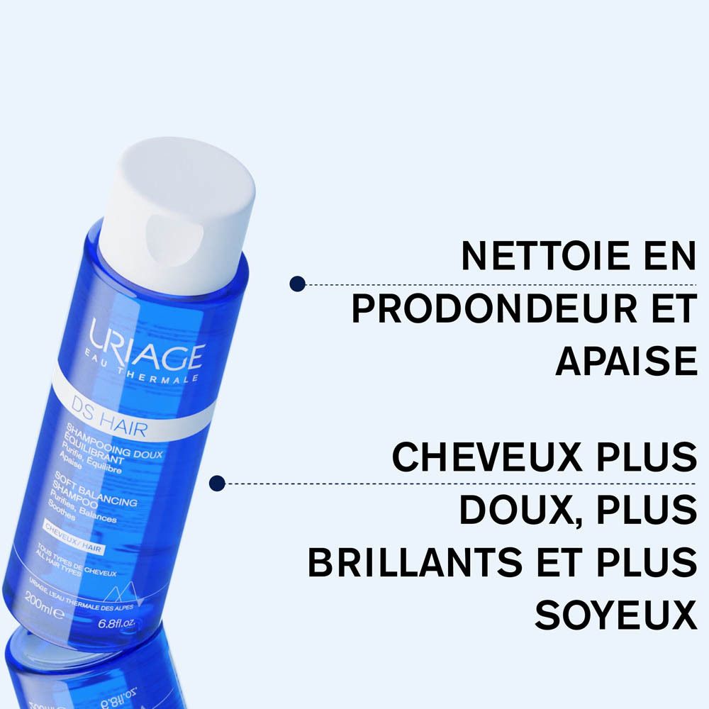 Flacon de shampooing bleu. Texte: Nettoie en profondeur et apaise, Cheveux plus doux, plus brillants et plus soyeux.