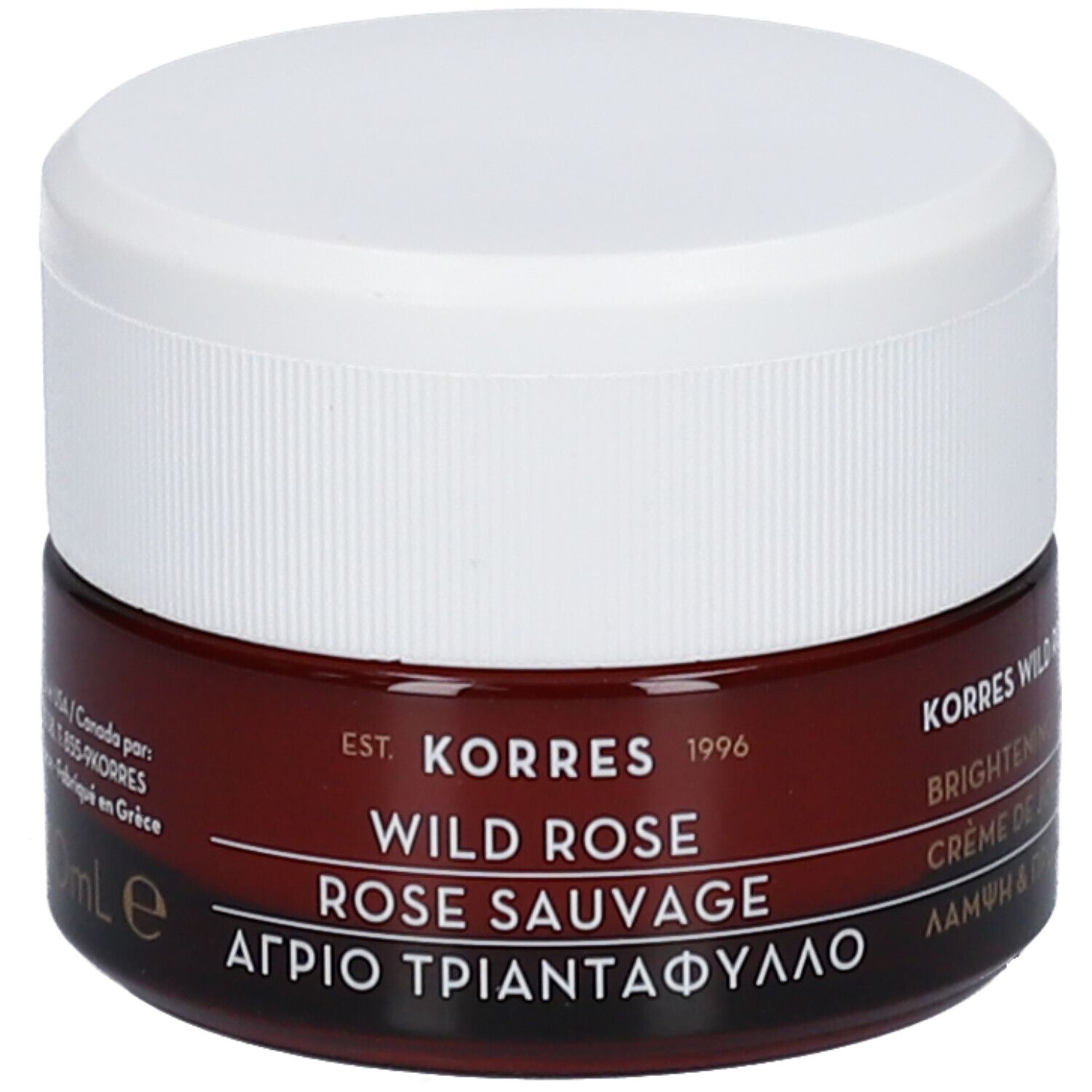 Pot de crème brun avec couvercle blanc. Inscription : KORRES, WILD ROSE, ROSE SAUVAGE. Texte grec.