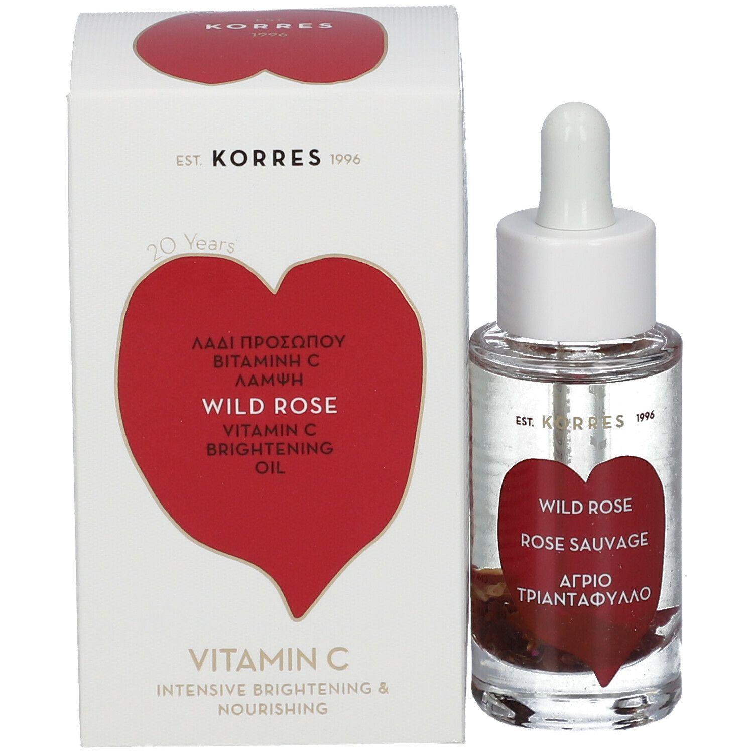 Produit avec emballage. Flacon avec pipette et carton. Étiquette rouge en forme de cœur avec texte. Wild Rose, Vitamin C, KORRES.