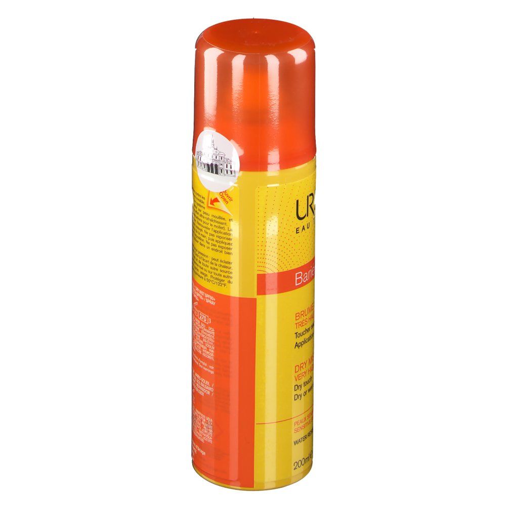 Spray solaire, flacon jaune-orange avec bouchon orange. Informations produit et code-barres imprimés.