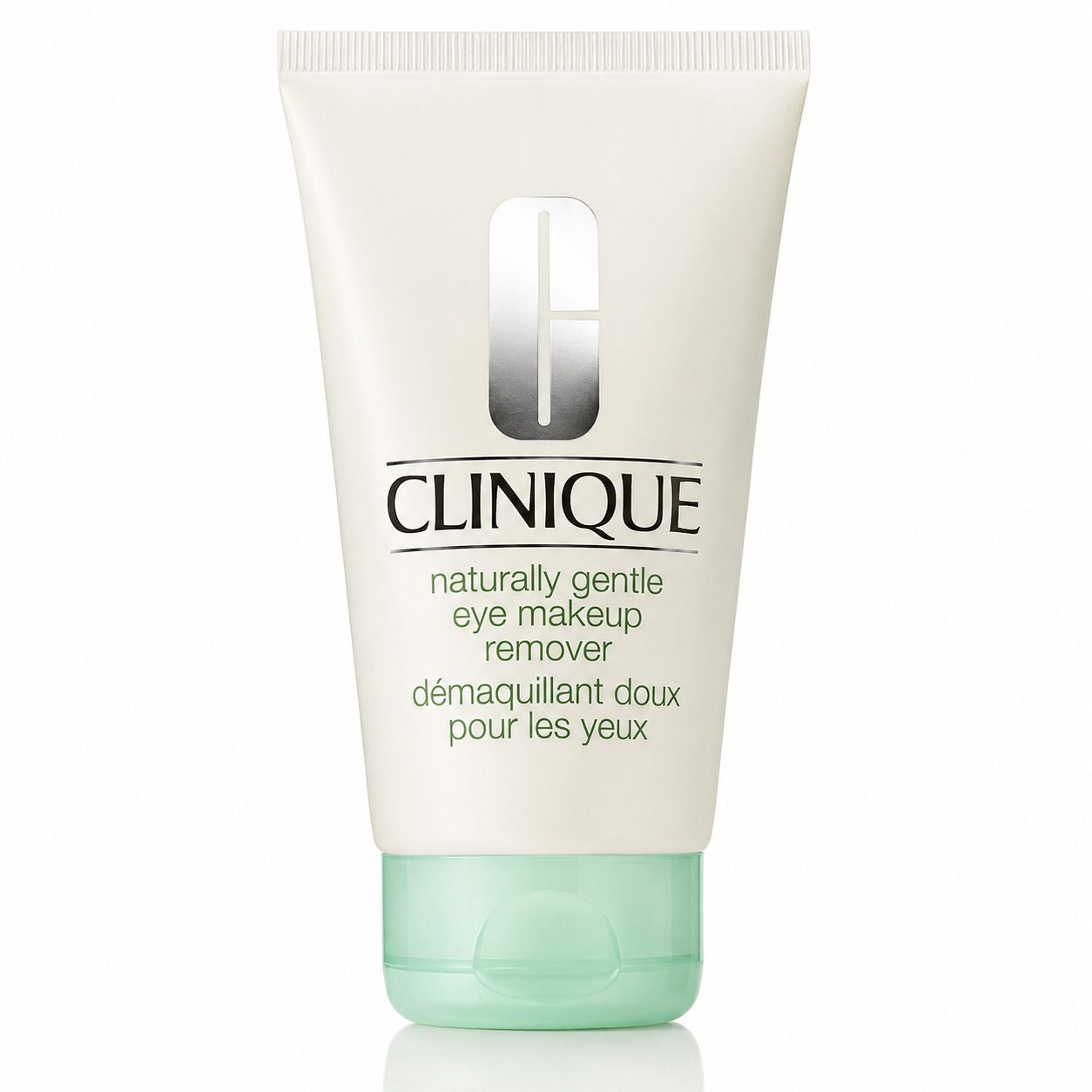 Tube blanc avec bouchon vert. Inscription CLINIQUE, suivie de "naturally gentle eye makeup remover" et "démaquillant doux pour les yeux".
