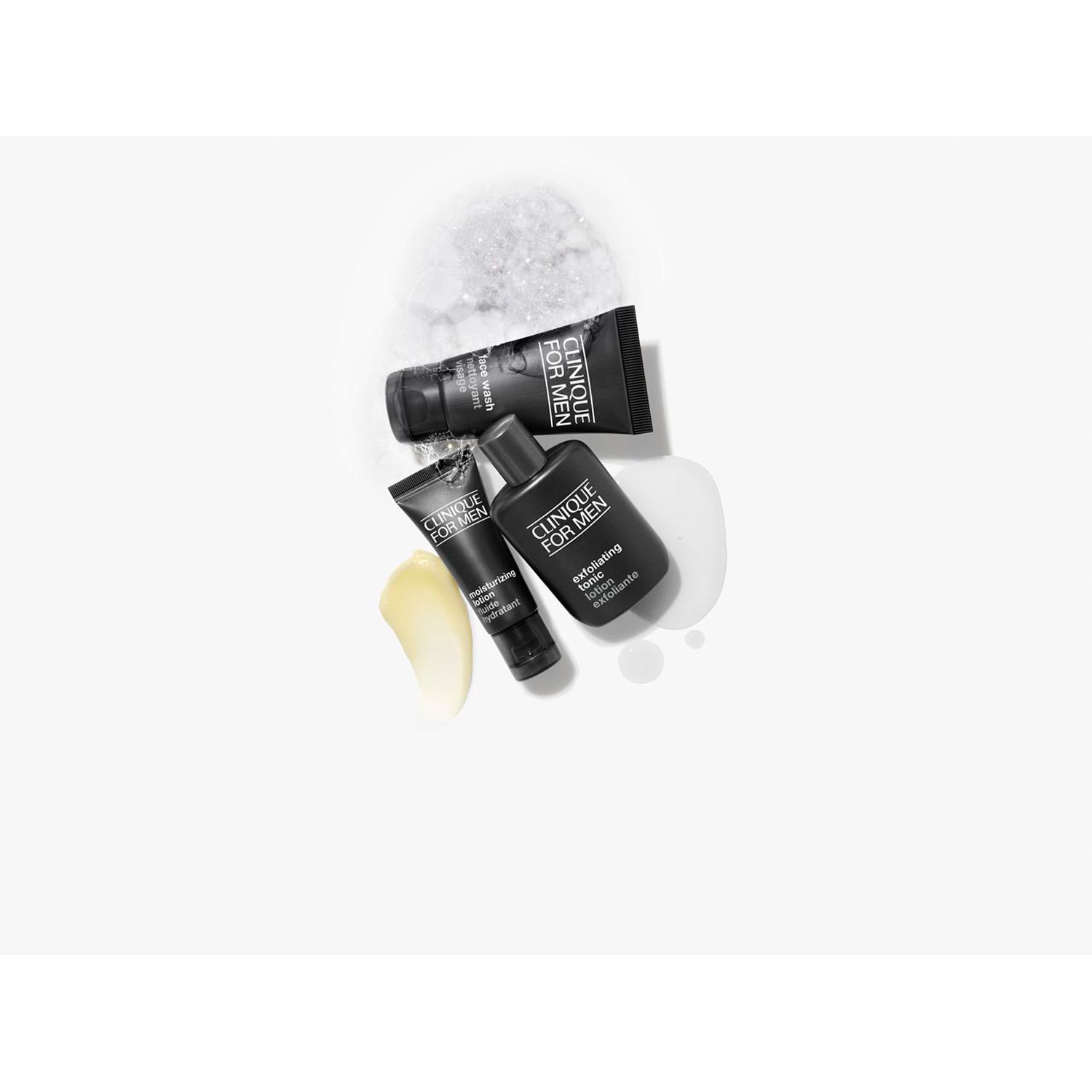 Trois produits sur fond blanc. Deux tubes et un flacon. Liquide jaune et blanc à côté.