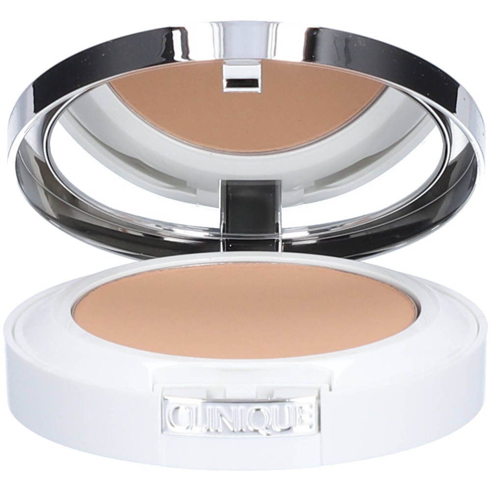 Compact poeder met spiegel. Witte behuizing met beige poeder. Merk Clinique zichtbaar.