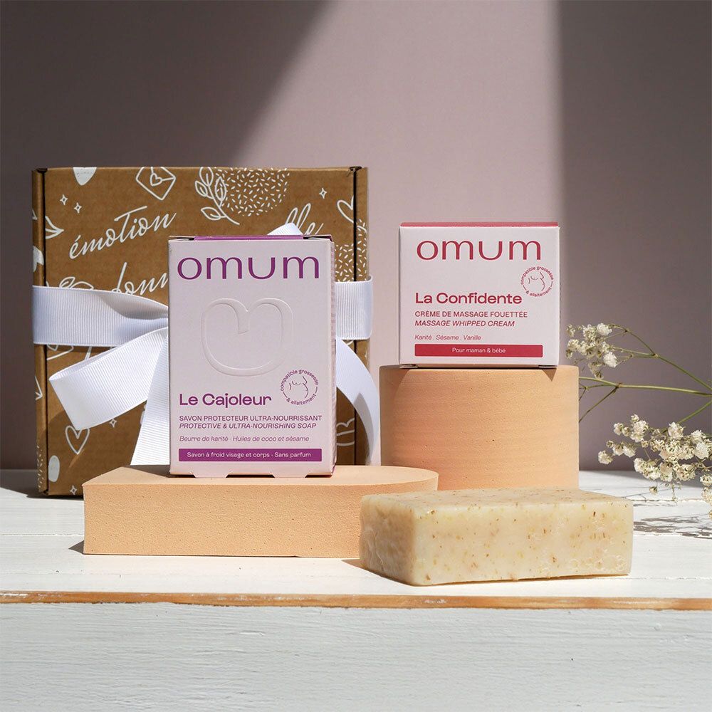 Coffret cadeau avec ruban blanc. Inscription: émotion bonne nouvelle.