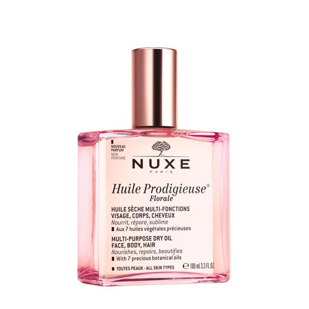 Nuxe Huile Prodigieuse Florale: schuin geplaatst flesje, roségouden dop, roze olie.