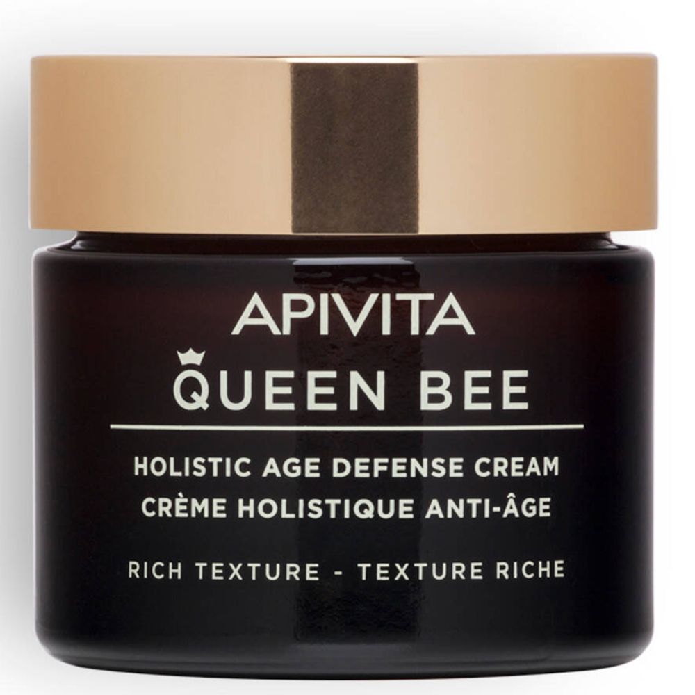 Donkerbruine crèmepot met gouden deksel. Opschrift: Apivita Queen Bee, Holistic Age Defense Cream.