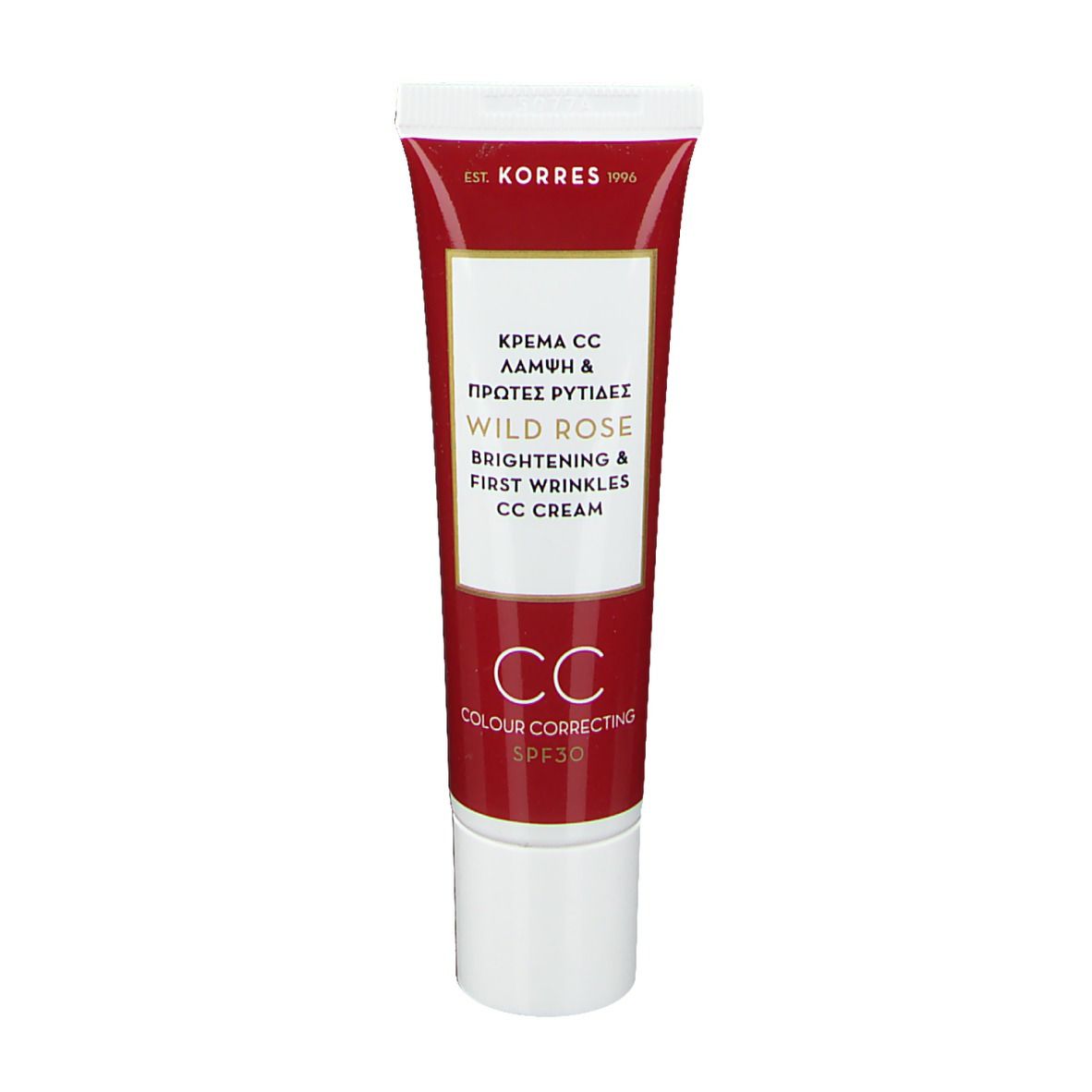 Tube de crème KORRES CC. Design rouge et blanc. Texte : Wild Rose, Brightening & First Wrinkles, CC Cream, SPF30. Bouchon blanc.