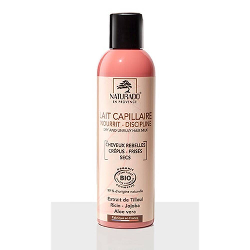 Flacon rose avec bouchon noir. Inscription: Naturado, Lait Capillaire, certification Bio. Pour cheveux secs et rebelles.