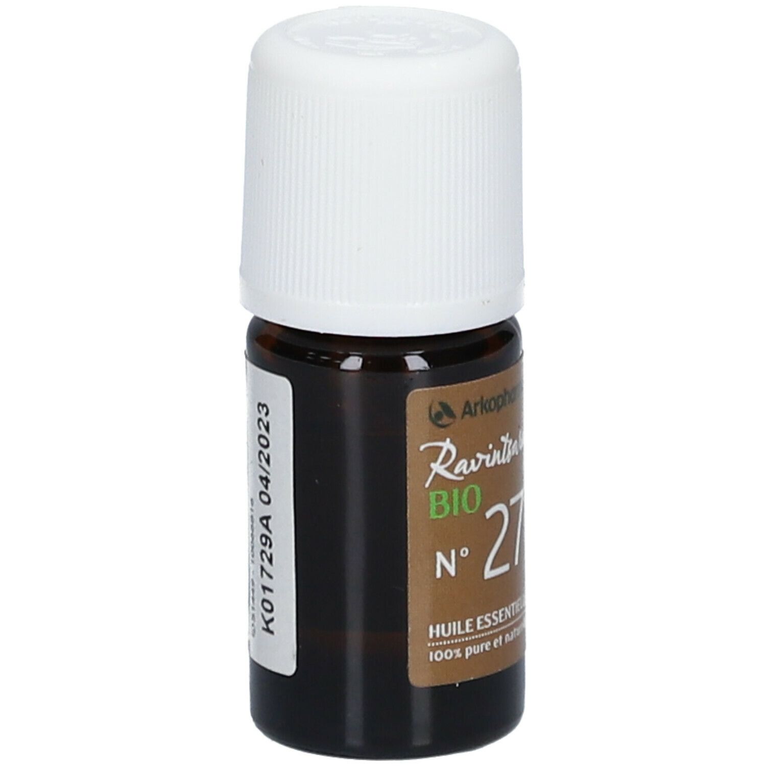 Bruine glazen fles met witte dop. Opschrift: Ravintsara BIO N°27 Huile essentielle. Merk: Arkopharma. Etiket.