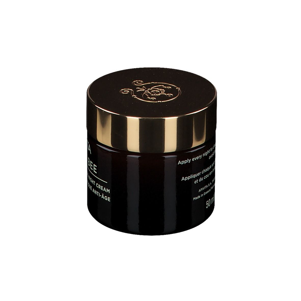 Pot en verre brun foncé avec couvercle doré. Inscription : APIVITA QUEEN BEE, Holistic Age Defense Night Cream.