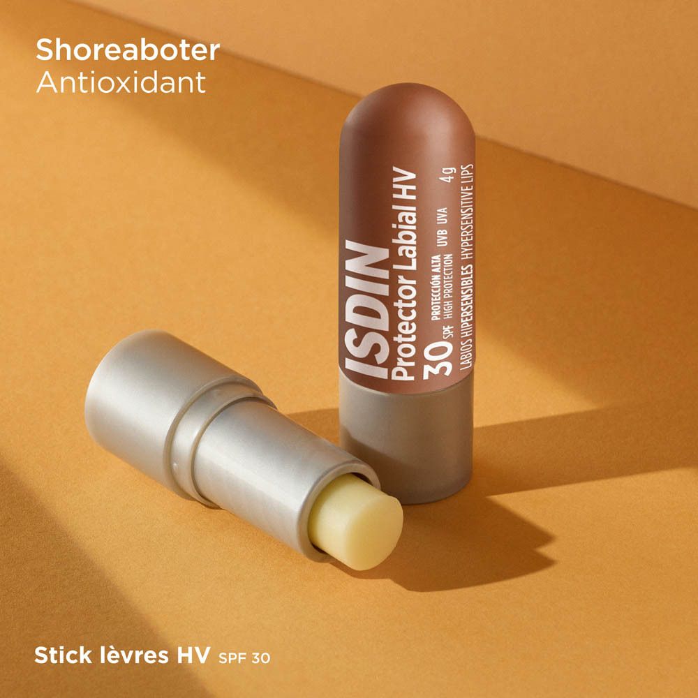 ISDIN Protector Labial HV LSF 30 et stick ouvert. Marron, base argentée. Texte. Fond orange.