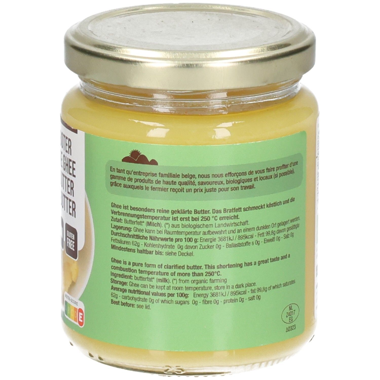 Dos d'un pot de beurre clarifié. Texte sur étiquette verte. Couvercle avec date.