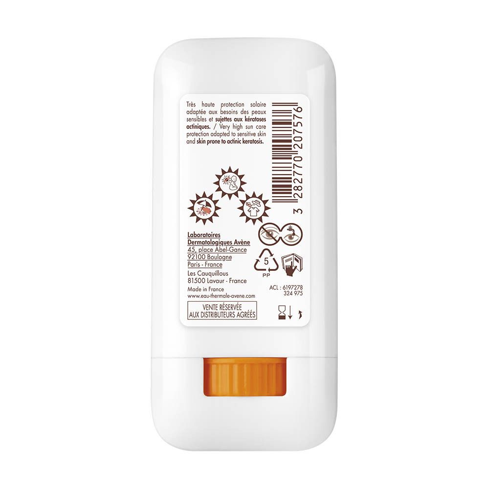 Arrière d'un stick solaire Avène avec informations produit et symboles.