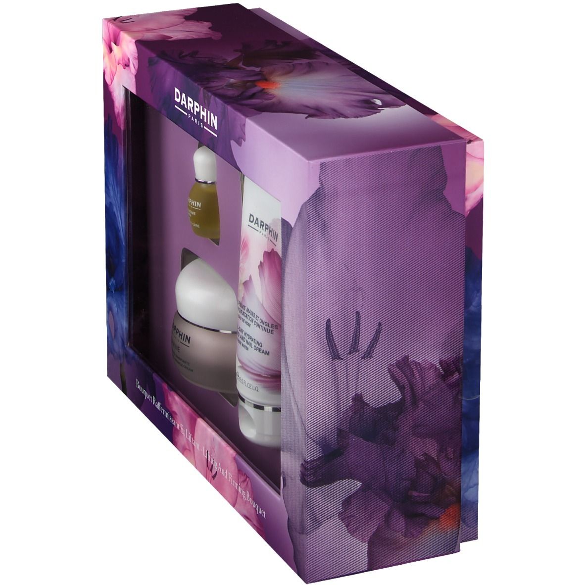 Geschenkdoos met producten. Venster toont flessen en potten. Verpakking met bloemenpatroon en merklogo.