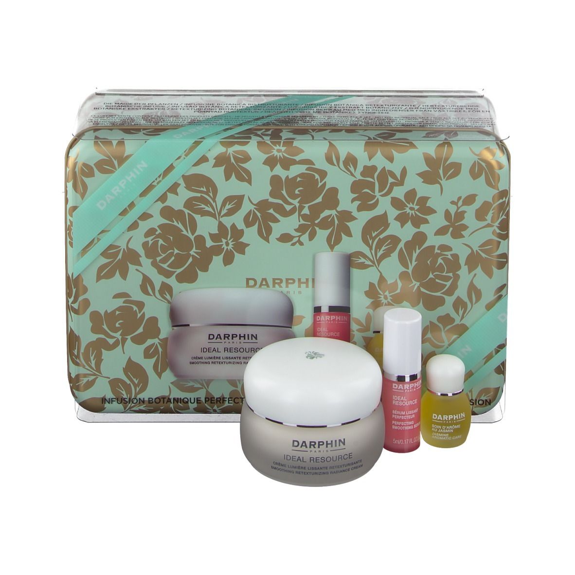 Geschenkdoos met bloemenpatroon, bevat crème, serum en olie. Merk: DARPHIN.
