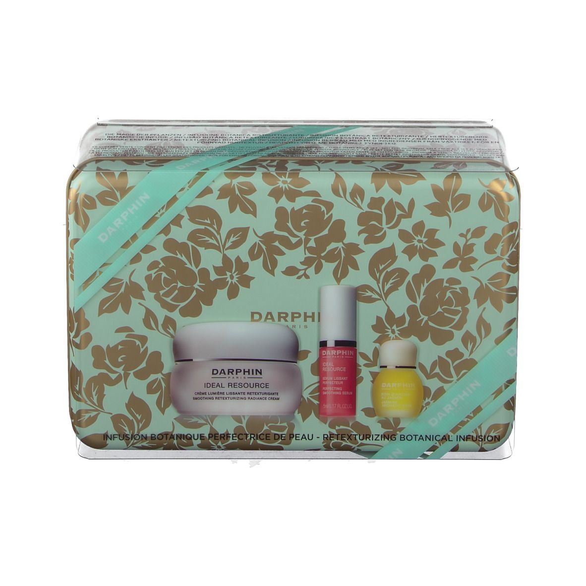 Geschenkdoos met bloemenpatroon, bevat crème, serum en olie. Merk: DARPHIN.